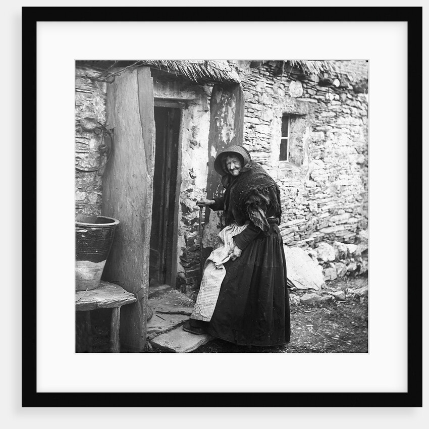 Woman entering Thatched Cottage, Sulby, Isle of Man by George Bellett Cowen